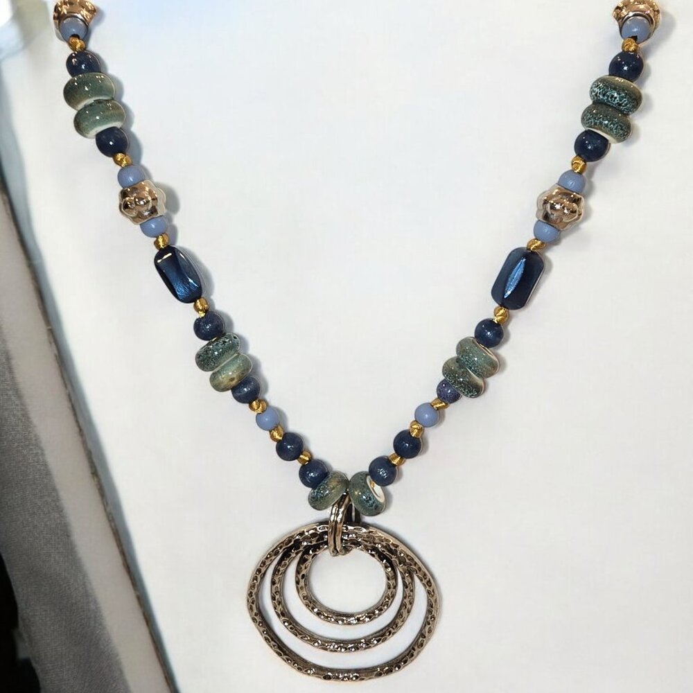 Blue Lagoon. Medium length chunky look. Knotted silk cord.  Blue/Sea green silve